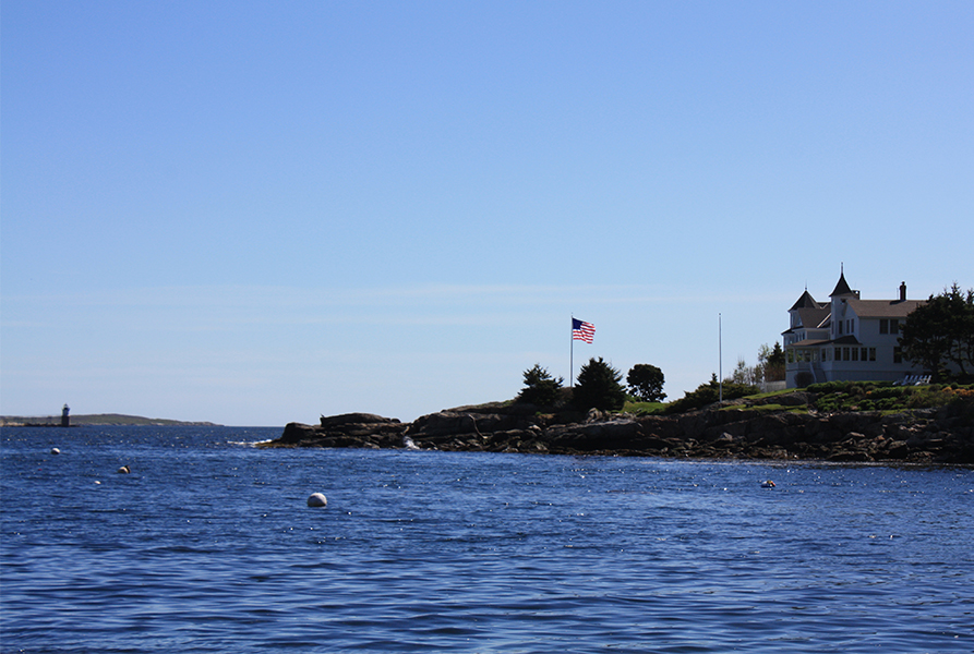 Maine coast with lighthouse in background