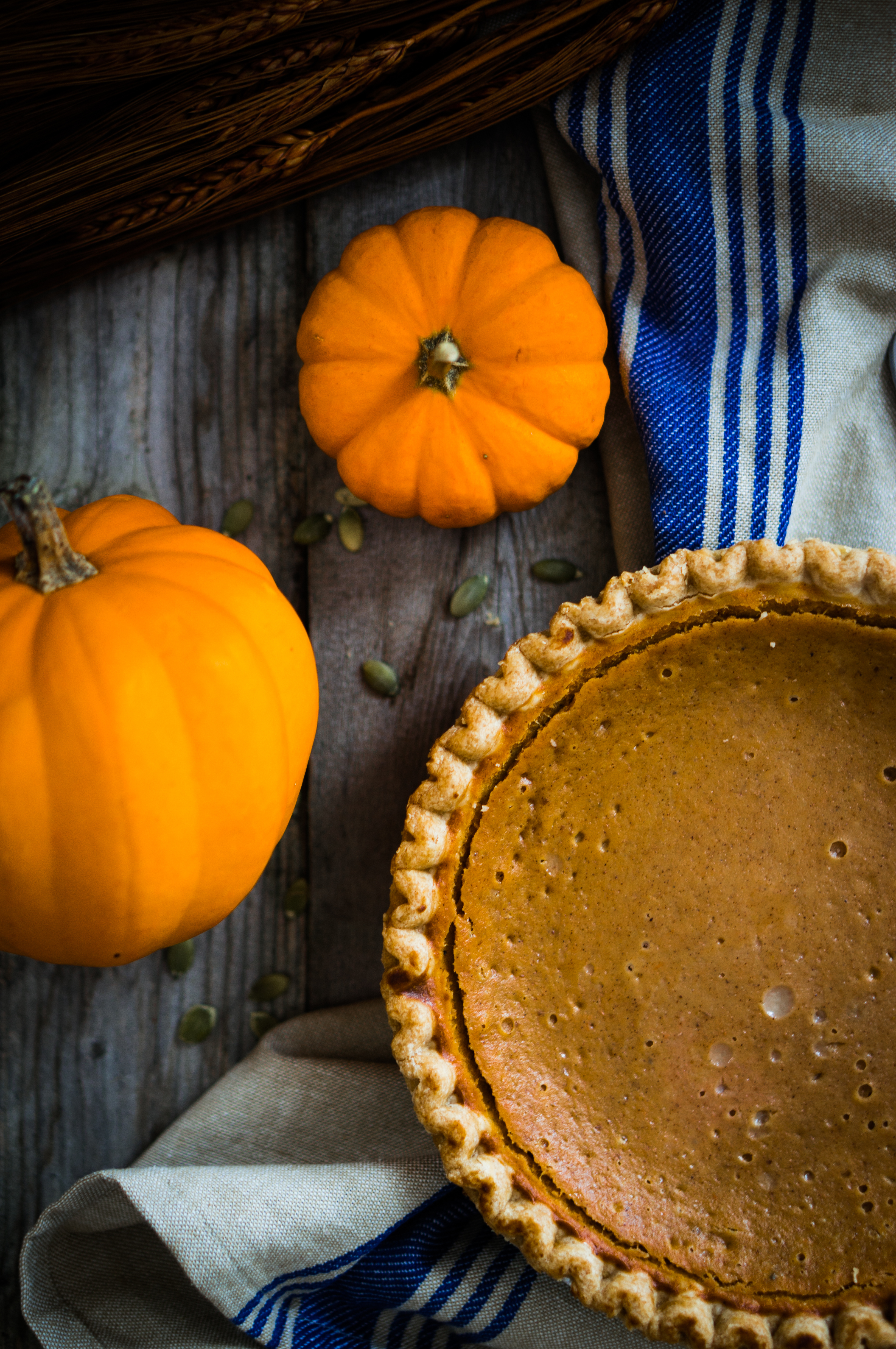 Pumpkin pie on rustic background